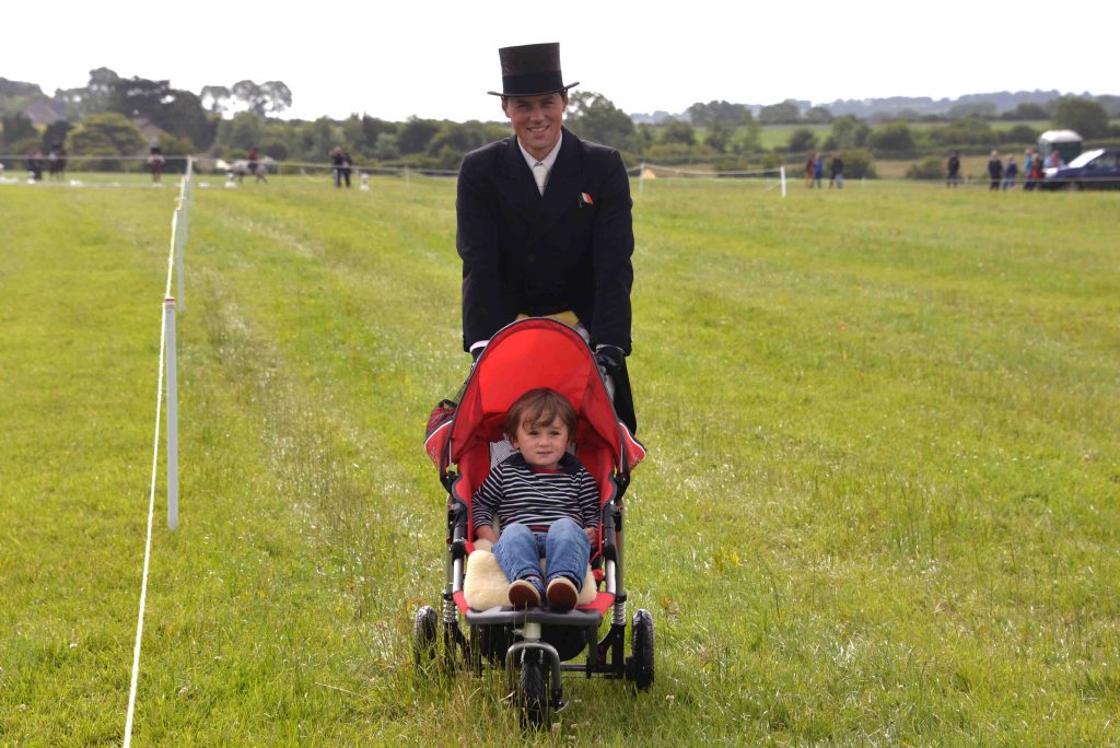 Sam Watson (pictured here with son Archie) is the overnight leader in the Haygain CIC3* ahead of the Cross Country phase on Sunday.